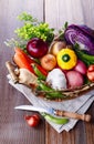 Organic healthy vegetables in the rustic basket Royalty Free Stock Photo