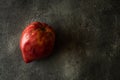 Organic Heirloom Tomato on Rustic Dark Background. Red Bull\'s Heart