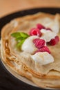 Organic home made Crepes with cream and raspberry Royalty Free Stock Photo