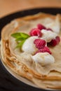 Organic home made Crepes with cream and raspberry Royalty Free Stock Photo