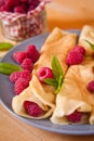 Organic home made Crepes with cream and raspberry Royalty Free Stock Photo