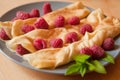 Organic home made Crepes with cream and raspberry
