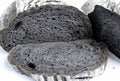 Organic homemade charcoal bread, black bread, Sliced bread on white background.