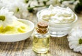 organic cosmetics with camomile extract on wooden table background Royalty Free Stock Photo