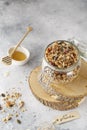 Organic homemade granola cereal with oats, nuts and dried berries. Muesli in a glass jar. Healthy vegan breakfast or snack. Copy Royalty Free Stock Photo