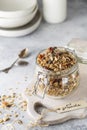 Organic homemade granola cereal with oats, nuts and dried berries. Muesli in a glass jar. Healthy vegan breakfast or snack. Copy Royalty Free Stock Photo