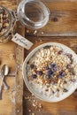 Organic homemade granola cereal with oats, nuts and dried berries. Muesli in a glass jar. Healthy vegan breakfast or snack. Copy Royalty Free Stock Photo