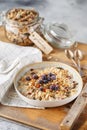 Organic homemade granola cereal with oats, nuts and dried berries. Muesli in a glass jar. Healthy vegan breakfast or snack. Proper Royalty Free Stock Photo