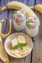 Organic homemade sweet milk dessert with banana, cinnamon and mi