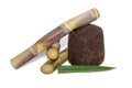 Organic Jaggery ( unrefined sugar ) and sugarcane isolated on white background Royalty Free Stock Photo