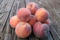 Organic, juicy peaches on a rustic wooden table