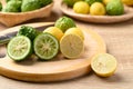 Kaffir lime and yellow lime on cutting wooden board, Citrus fruit Royalty Free Stock Photo