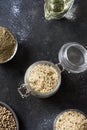 Organic kernels hemp in glass jar on black. Vertical format Royalty Free Stock Photo