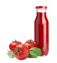 Organic ketchup in glass bottle, fresh tomatoes and basil on white background