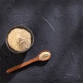 Organic Maca powder in the spoon - Lepidium meyenii Royalty Free Stock Photo