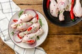 Organic marinated chicken legs on wooden table background. Healthy eating concept. Top view Royalty Free Stock Photo