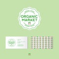 Organic market logo. Organic food emblems. Green badge with letters and small cherries. Identity. Pattern and business card. Royalty Free Stock Photo