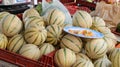 organic melons on market place in france