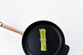 Organic mini asparagus. White background, top view, space for text. Royalty Free Stock Photo