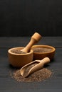 Organic natural chia seeds, bowl and wooden scoop close-up on wooden background or table Royalty Free Stock Photo