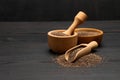 Organic natural chia seeds, bowl and wooden scoop close-up on wooden background or table Royalty Free Stock Photo