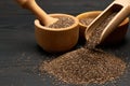 Organic natural chia seeds, bowl and wooden scoop close-up on wooden background or table Royalty Free Stock Photo