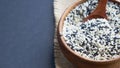 Organic natural sesame seeds wooden spoon. toasted sesame seeds. Raw, whole, unprocessed. Natural light. Selective focus Royalty Free Stock Photo