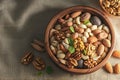 Organic nut display Wooden plate spills various nuts on table