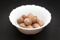 Organic Nutmeg Seed in ceramic bowl