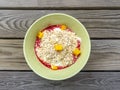 Organic oats in bowl with fruits and yoghurt