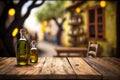 Organic olive oil in glass bottle over wooden rustic table with copy space for advertisement