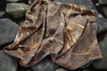 organic outlawed throw on a stone surface Royalty Free Stock Photo