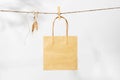 Organic paper bag hanging on the rope, natural mockup