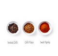 Organic Paprika Powder, Chilli Flakes and Smoked Chilli Flakes on White Background