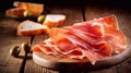 organic parma ham dry cured jamon on a wooden board