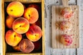 Organic peaches and pastries on an old white wooden table.Healthy versus unhealthy food concept Royalty Free Stock Photo