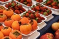 Organic persimmon fruit in pile at local farmers market. Royalty Free Stock Photo