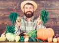 Organic pest control. Man with beard proud of his harvest wooden background. Excellent quality harvest. Organic
