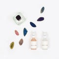 Organic pharmacy cosmetics with natural agate stone on white background. Flat lay. Top view of bottles of cream. Natural beauty