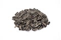 Organic pile of sunflower seeds isolated on white background. Royalty Free Stock Photo