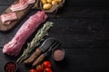 Organic pork fillet with ingredients and herbs for grill or baking, sage, potatoe, on black wooden table background , with Royalty Free Stock Photo