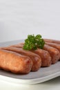 organic pork sausages on a plate