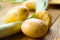 Organic potato on wood - selective focus