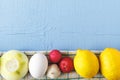 Organic product for cooking healthy food. Uncooked egg and ripe onion, garlic, lemon, radish on wooden background. Top view with c Royalty Free Stock Photo