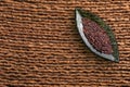 Organic quinoa black seeds in leaf shaped container - Chenopodium quinoa Royalty Free Stock Photo