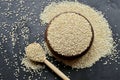 Organic quinoa grains in wooden bowl and spoon on black concrete background, top view Royalty Free Stock Photo