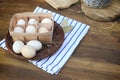 Organic raw chicken eggs in egg box on old style table Royalty Free Stock Photo