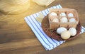 Organic raw chicken eggs in natural egg box on an old style Royalty Free Stock Photo