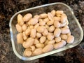 Organic Raw Macadamia Nuts in Glass Bowl