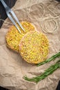 Organic raw minced meat or beef patties breaded Royalty Free Stock Photo